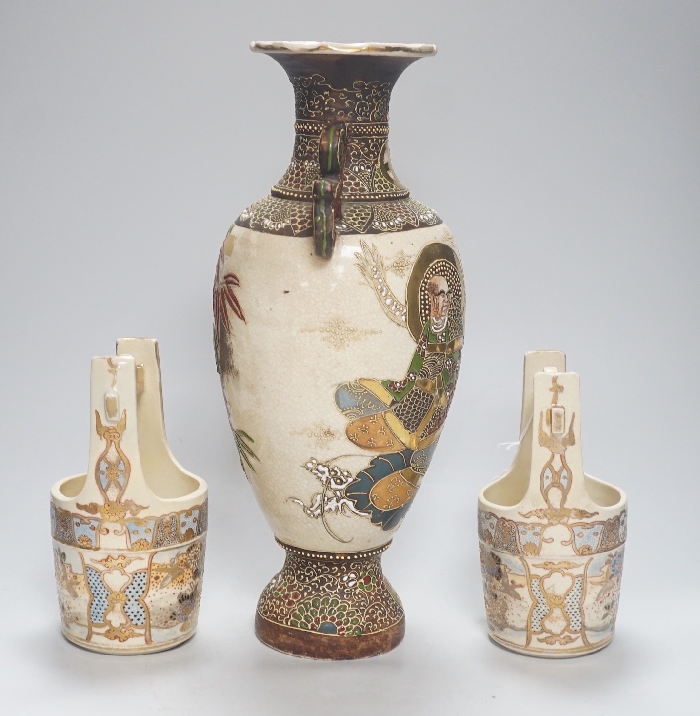 A pair of Japanese Satsuma bucket vases and another vase, 37cm
